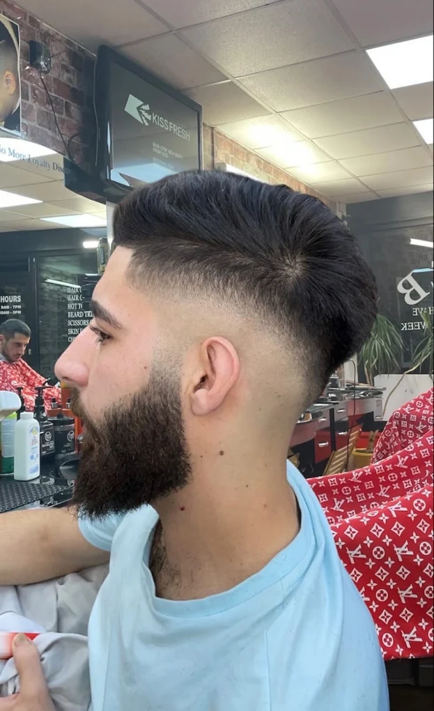 Mid Skin Fade haircut example at Reb Barber