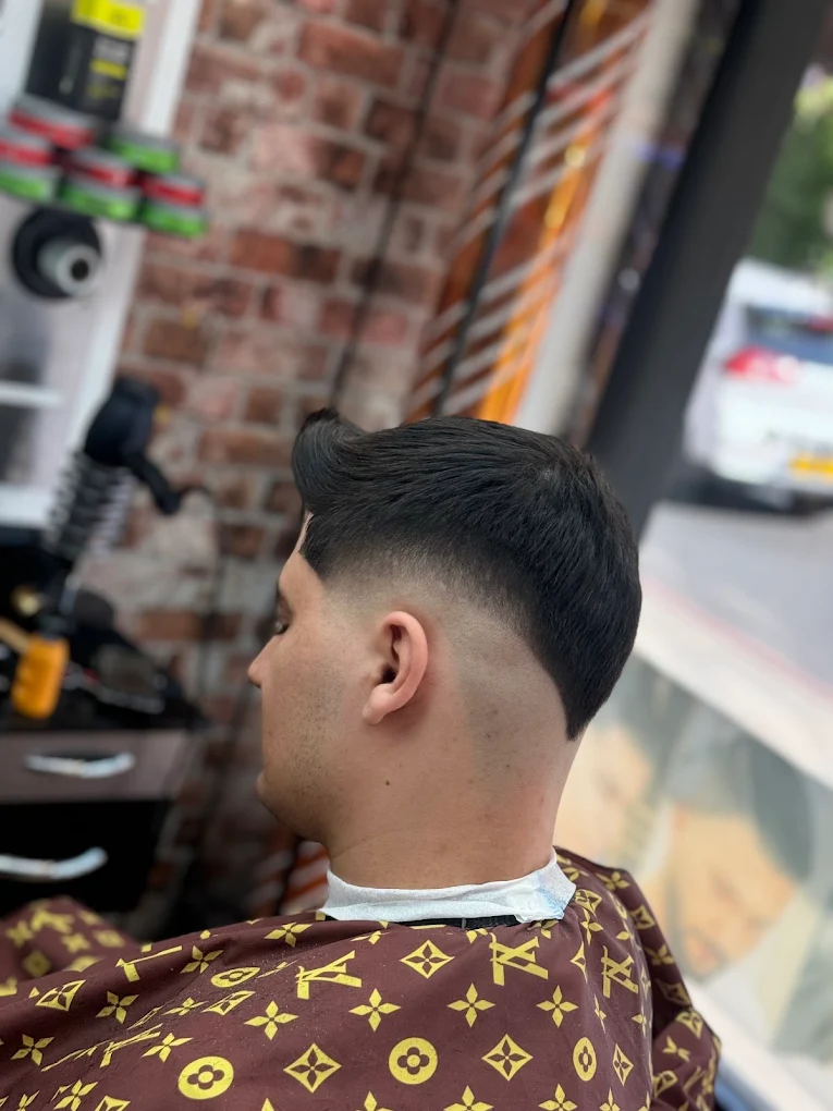Low Skin Fade haircut example at Reb Barber